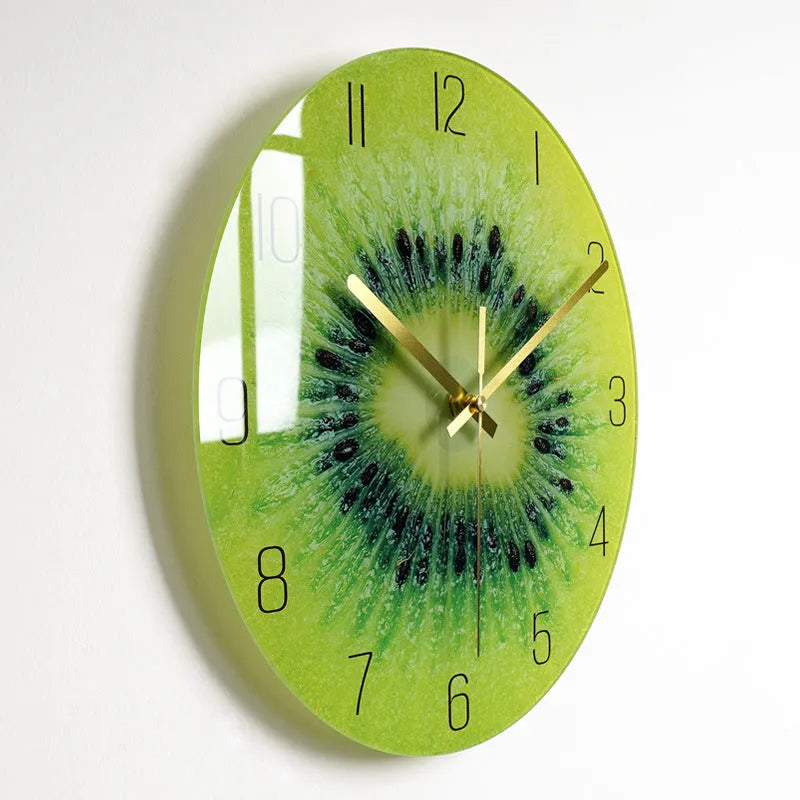 Round silent wall clock with acrylic glass dial, shown in a living room setting.