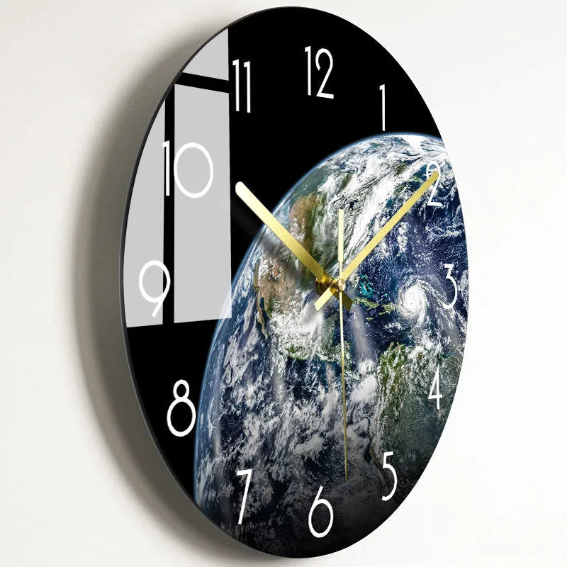 Round silent wall clock with acrylic glass dial, shown in a living room setting.