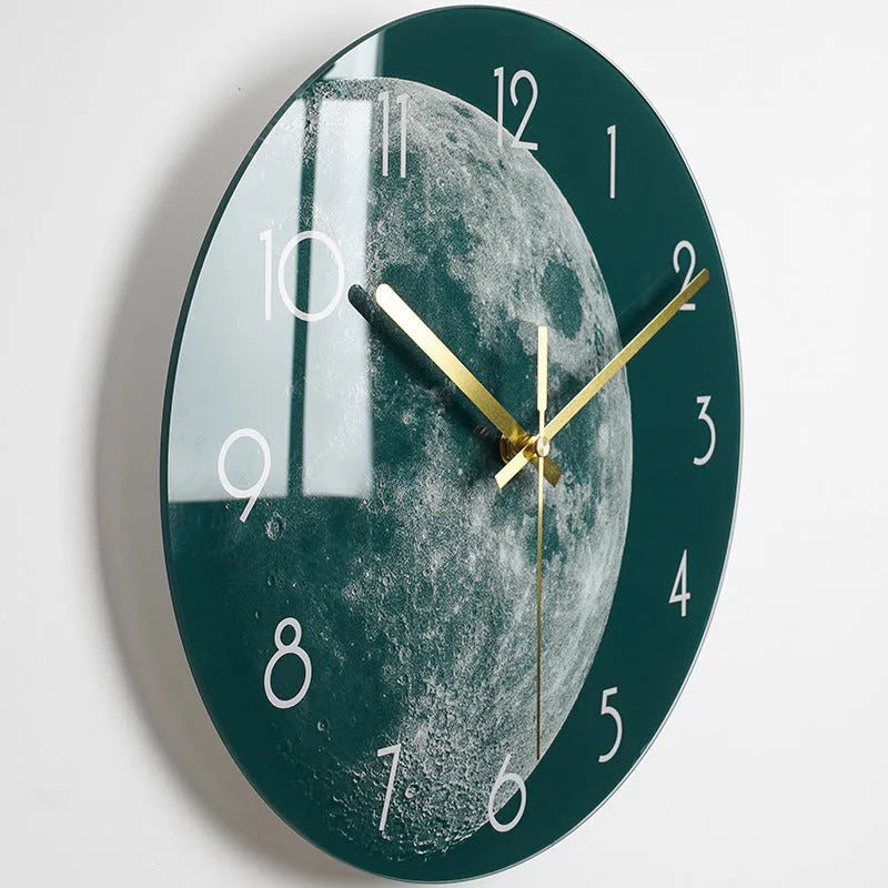 Round silent wall clock with acrylic glass dial, shown in a living room setting.