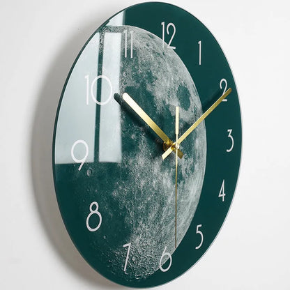 Round silent wall clock with acrylic glass dial, shown in a living room setting.