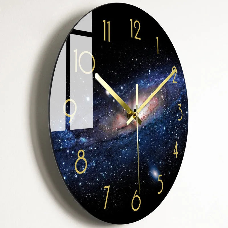 Round silent wall clock with acrylic glass dial, shown in a living room setting.
