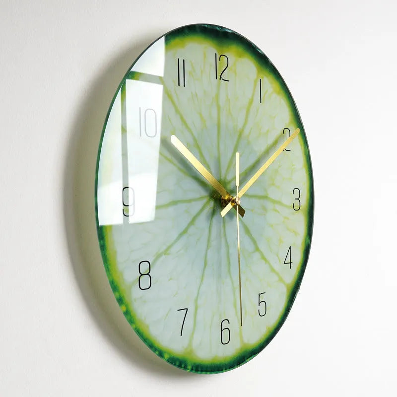 Round silent wall clock with acrylic glass dial, shown in a living room setting.
