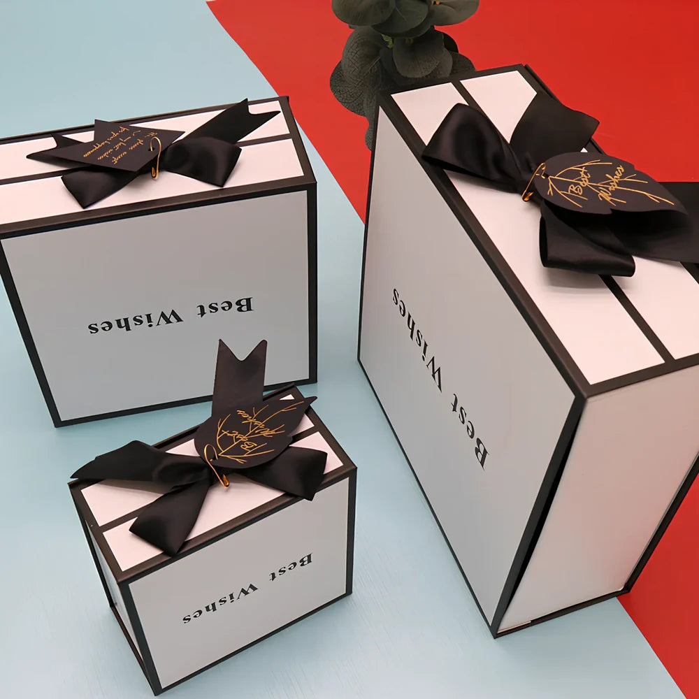 White square clamshell paper gift box for cosmetics, sizes 12-21cm with raffia and bag options