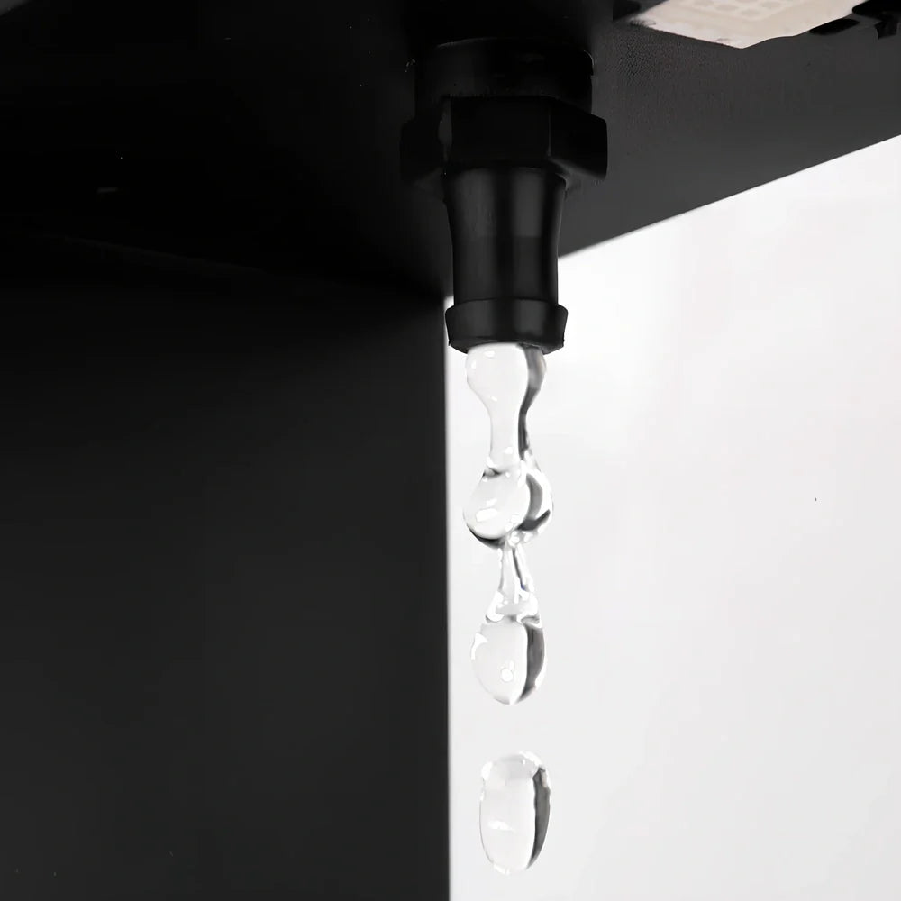 Obsidian black anti-gravity floating sand drop table lamp with geometric hourglass and LED glow