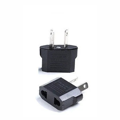 Black and white travel power adapter with three AC sockets showing AU EU US plug options