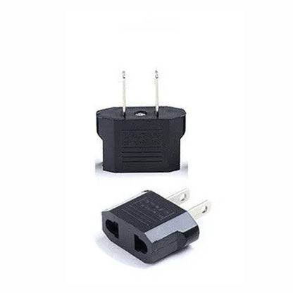 Black and white travel power adapter with three AC sockets showing AU EU US plug options