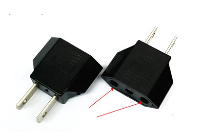 Black and white travel power adapter with three AC sockets showing AU EU US plug options