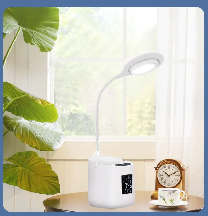 White USB desk lamp with touch switch on a dormitory desk.
