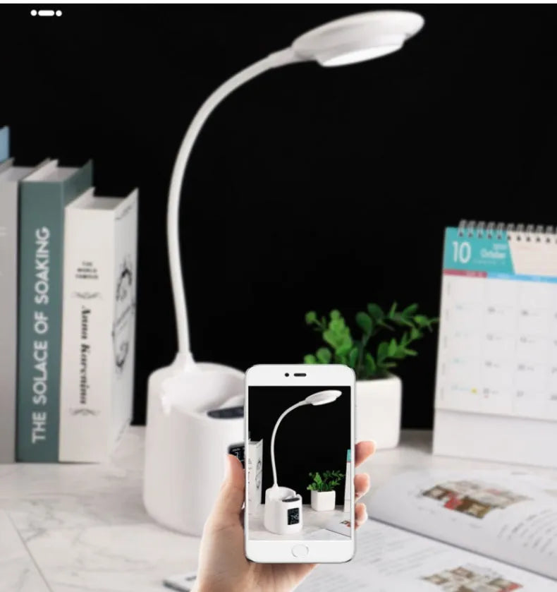 White USB desk lamp with touch switch on a dormitory desk.
