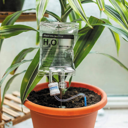 A transparent, self-watering plant feeder device with a 1000ml or 3000ml capacity, designed to keep indoor and outdoor plants hydrated for up to 7 days.