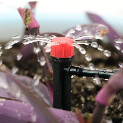 50-metre automatic garden irrigation system kit showing timer, tubing, and spray nozzles arranged for installation