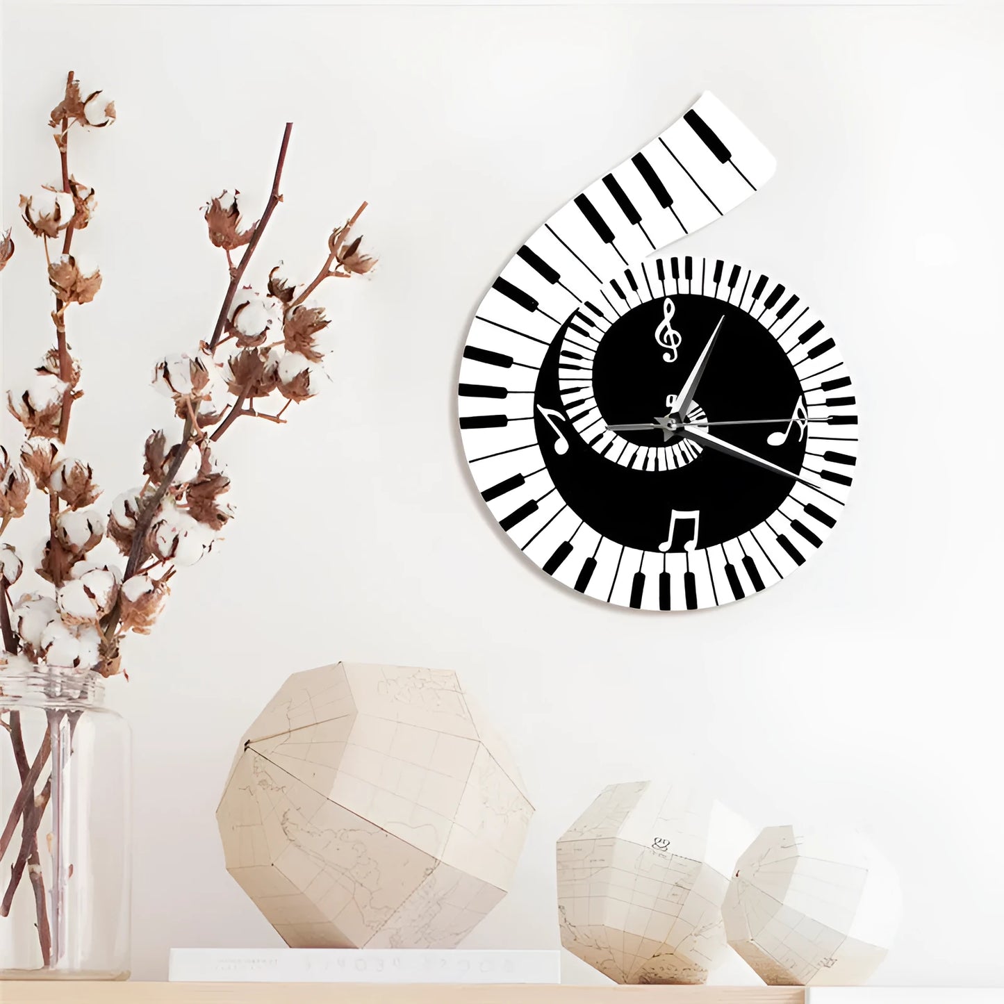Irregular shaped treble clef piano keyboard musical notes wall clock in black and white colours measuring 69x35x62cm