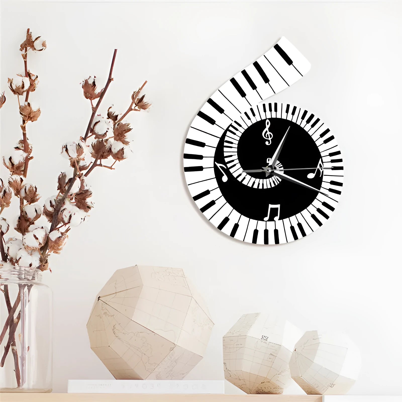 Irregular shaped treble clef piano keyboard musical notes wall clock in black and white colours measuring 69x35x62cm