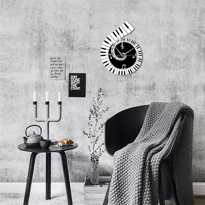 Irregular shaped treble clef piano keyboard musical notes wall clock in black and white colours measuring 69x35x62cm