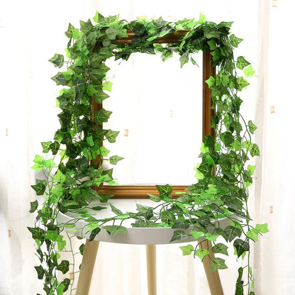 Premium silk hanging leaf garland with realistic green leaves and flexible rattan vine for customizable home, wedding, and garden decor