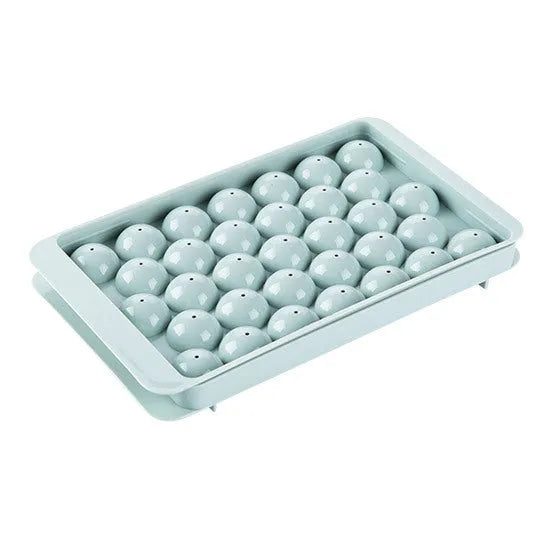 Sky blue and pink 3D round ice moulds creating spherical ice balls for drinks