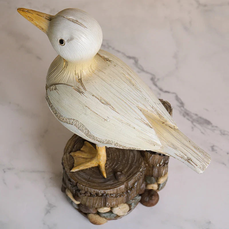 Decorative resin seagull statue with natural colors and textures, perfect for coastal home and office decor