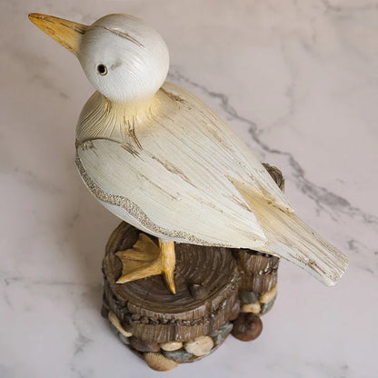 Decorative resin seagull statue with natural colors and textures, perfect for coastal home and office decor