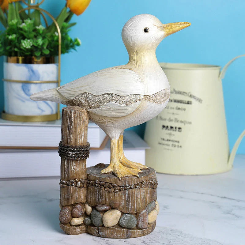 Decorative resin seagull statue with natural colors and textures, perfect for coastal home and office decor