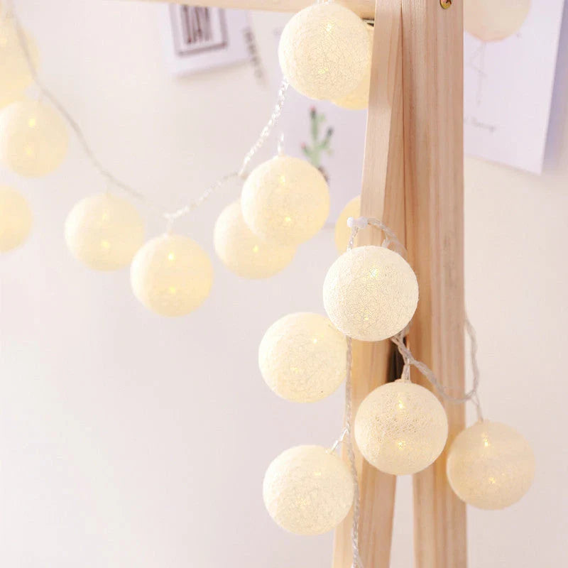 Cosy cotton ball fairy lights with warm, enchanting glow - natural, battery-powered home decor