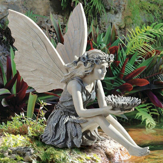 Beautifully detailed fairy statue with flower crown and petal skirt, holding a sunflower bowl in a garden setting