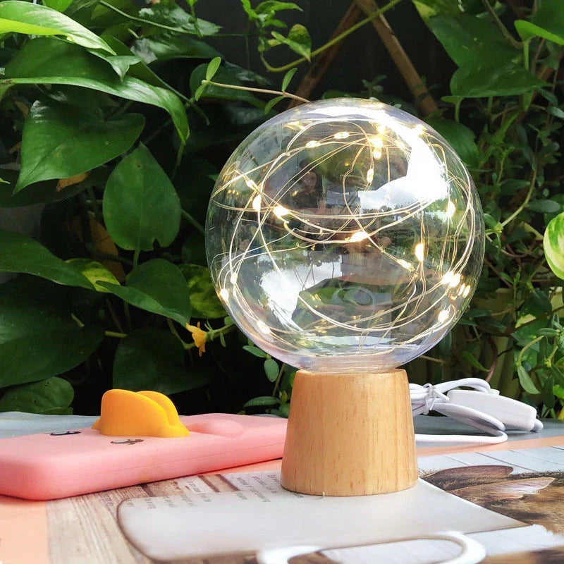 LED Crystal Ball Lamp with warm, magical lighting and elegant wooden base