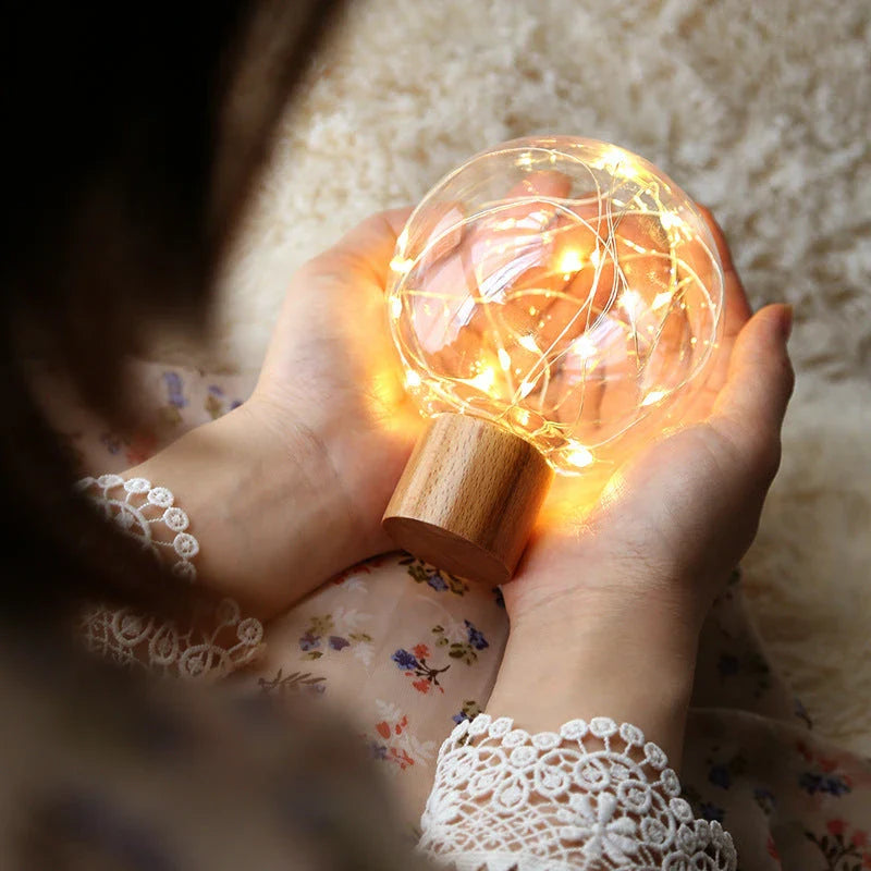 LED Crystal Ball Lamp with warm, magical lighting and elegant wooden base