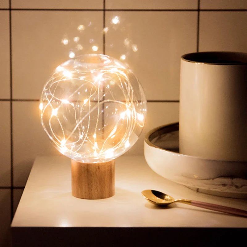 LED Crystal Ball Lamp with warm, magical lighting and elegant wooden base