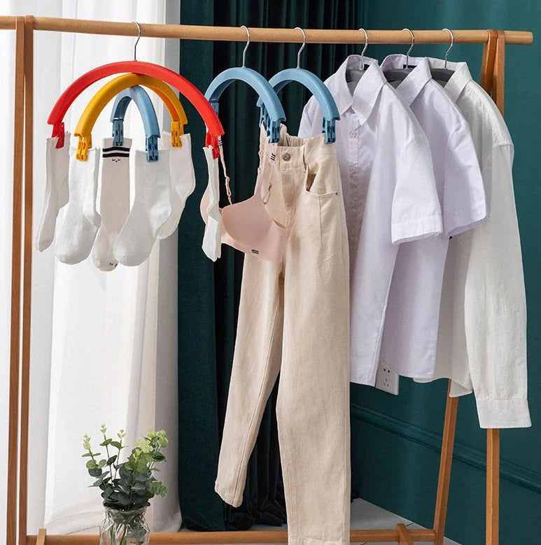 Versatile rotating clothes drying rack with a rainbow-inspired design, providing a practical and space-saving laundry solution