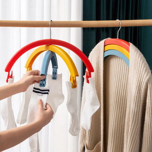 Versatile rotating clothes drying rack with a rainbow-inspired design, providing a practical and space-saving laundry solution