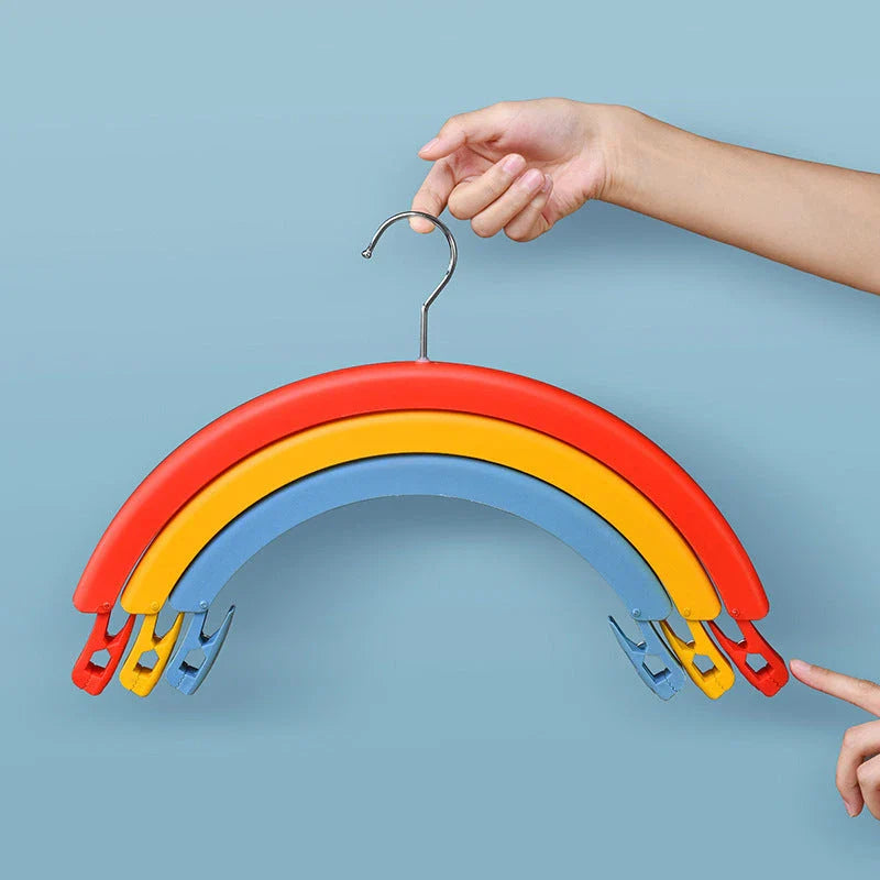 Versatile rotating clothes drying rack with a rainbow-inspired design, providing a practical and space-saving laundry solution