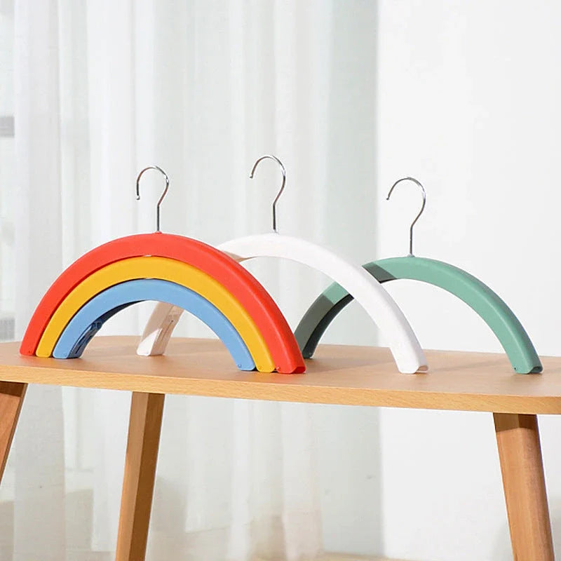 Versatile rotating clothes drying rack with a rainbow-inspired design, providing a practical and space-saving laundry solution