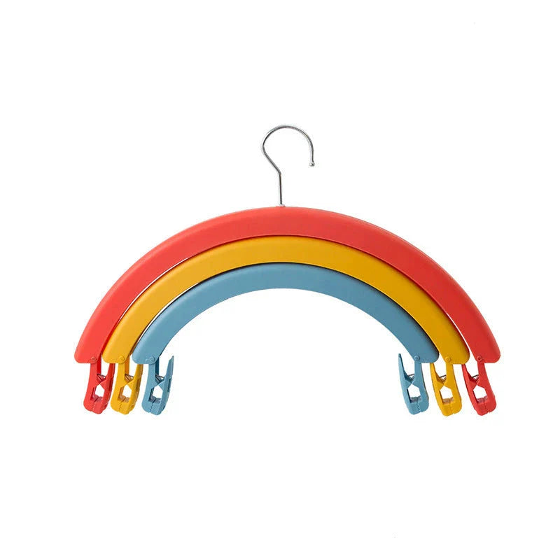 Versatile rotating clothes drying rack with a rainbow-inspired design, providing a practical and space-saving laundry solution