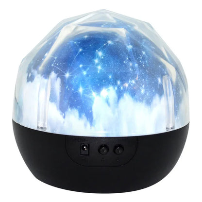 A cartoon-style starry sky projector lamp projecting constellation scenes onto a dark wall.
