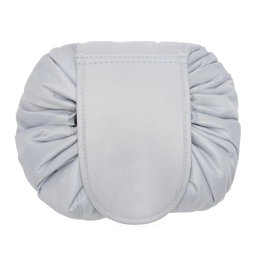 Stylish and roomy makeup travel bag with multiple color options, featuring a spacious interior and drawstring closure for secure storage of beauty essentials.
