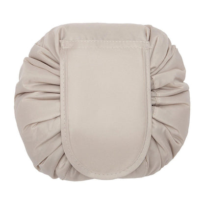 Stylish and roomy makeup travel bag with multiple color options, featuring a spacious interior and drawstring closure for secure storage of beauty essentials.