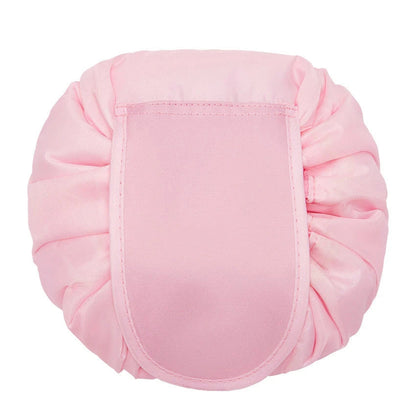 Stylish and roomy makeup travel bag with multiple color options, featuring a spacious interior and drawstring closure for secure storage of beauty essentials.