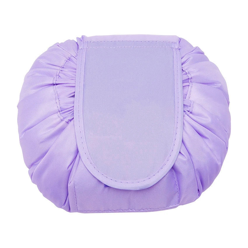 Stylish and roomy makeup travel bag with multiple color options, featuring a spacious interior and drawstring closure for secure storage of beauty essentials.