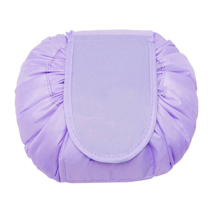 Stylish and roomy makeup travel bag with multiple color options, featuring a spacious interior and drawstring closure for secure storage of beauty essentials.