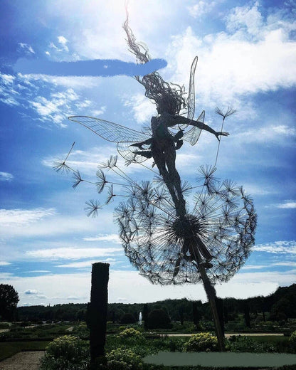 Enchanting fairy garden sculptures made of metal, featuring playful designs of fairies and pixies among dandelions and flowers.