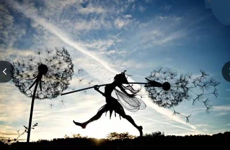 Enchanting fairy garden sculptures made of metal, featuring playful designs of fairies and pixies among dandelions and flowers.
