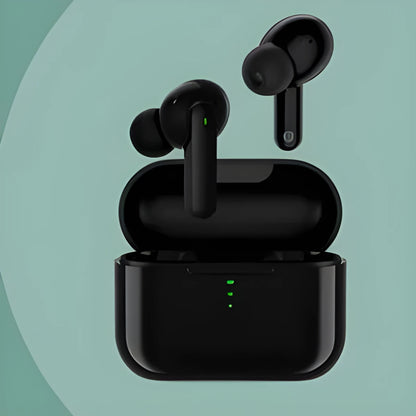 Black or white wireless Bluetooth in-ear headphones with a magnetic charging case on a table.