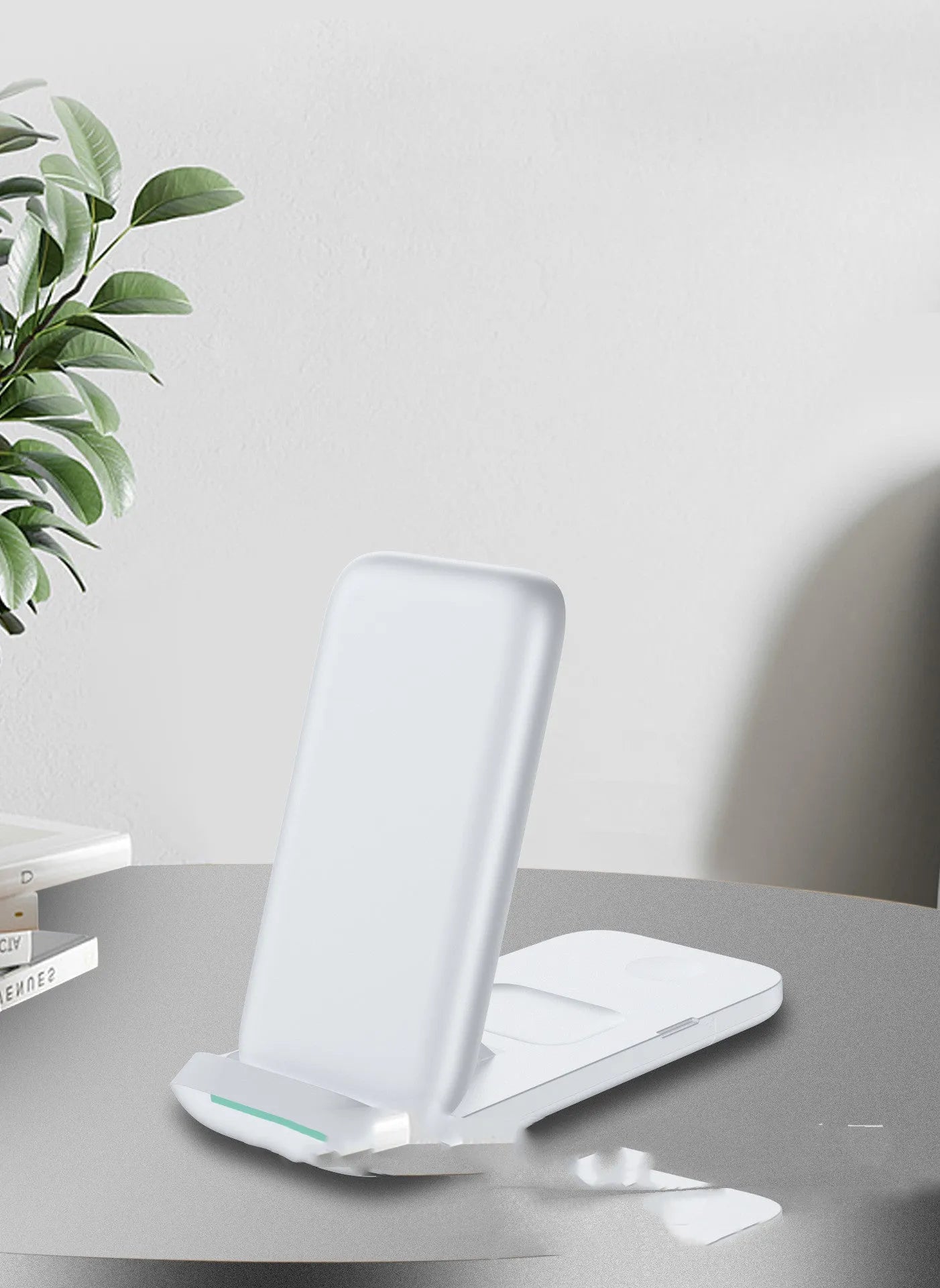 Black and white foldable 3-in-1 wireless charger showing three devices charging simultaneously