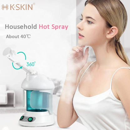Facial steamer device with rotating nozzle and water tank for spa-like skin rejuvenation at home