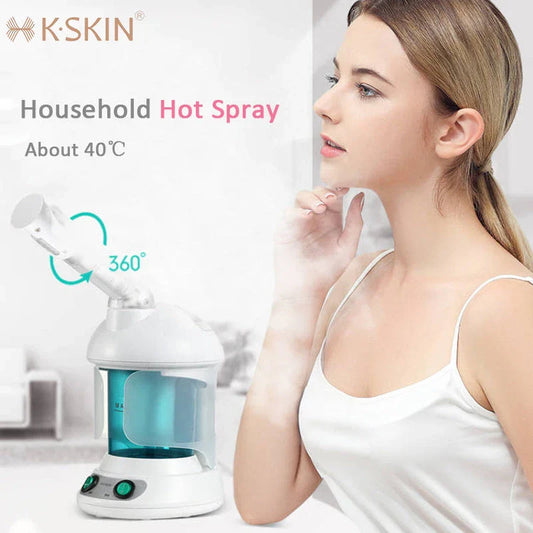 Facial steamer device with rotating nozzle and water tank for spa-like skin rejuvenation at home