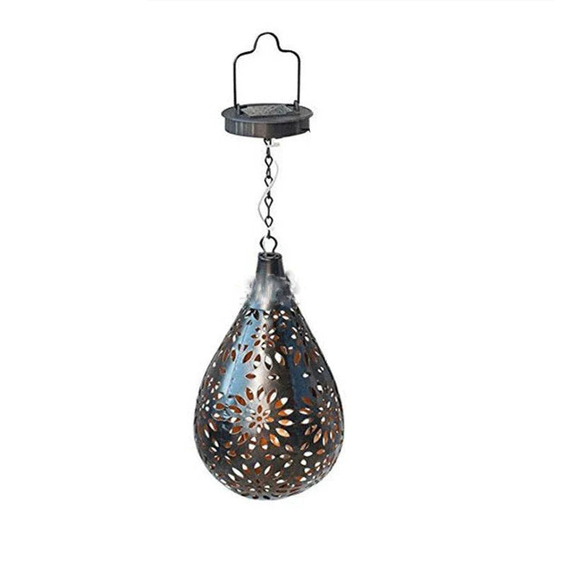 Elegant solar-powered garden lantern with a drop-shaped metal design and a soft, flower-patterned glow