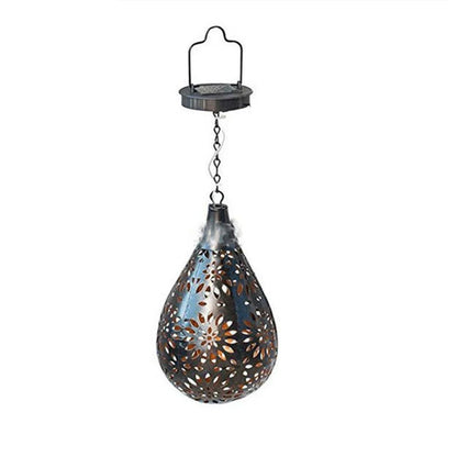 Elegant solar-powered garden lantern with a drop-shaped metal design and a soft, flower-patterned glow