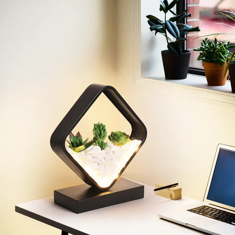 Black metal bedside table lamp with creative succulent design elements and push button switch