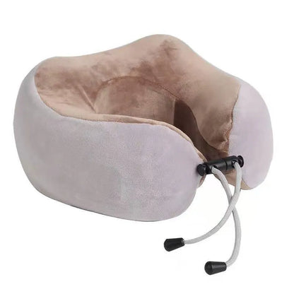 Brown U shaped electric neck massage pillow on a grey background