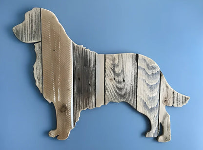 Handcrafted wooden dog breed decorations showing manual carving details